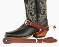 A brown leather spur strap with a metal buckle.