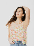 Camisole ample et confortable à motif fleurie blanc, jaune et vert avec fines bretelles. Designer québécois.