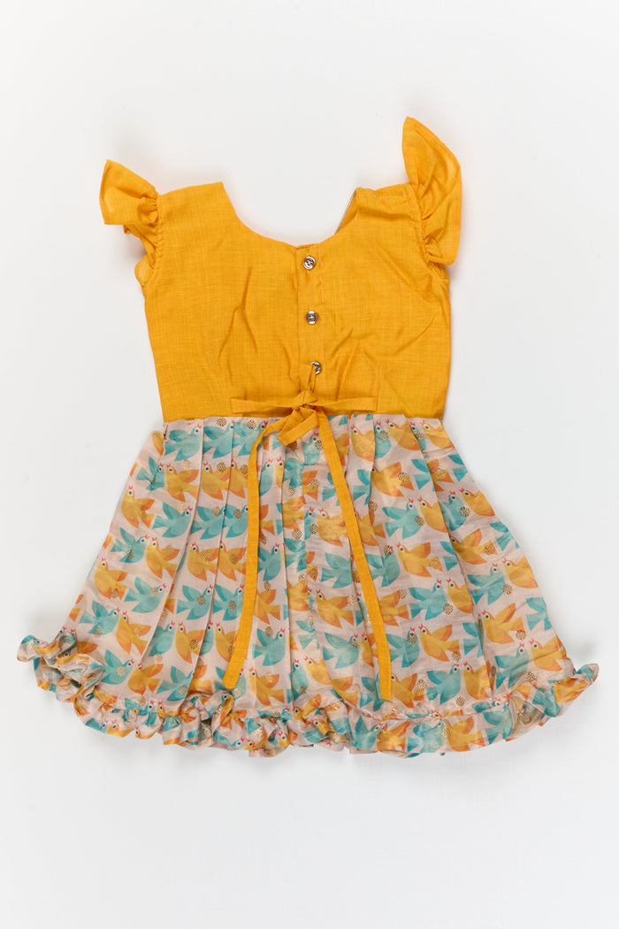 The Nesavu Silk Frock Baby Girl Chanderi Silk Frock with Bird Print for Birthdays and Day Outings Nesavu Nesavu baby girl chanderi cotton silk frock with bird print and ruffle sleeves for festive outings