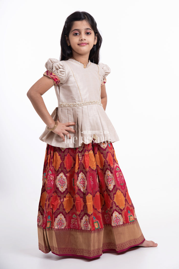 The Nesavu Pattu Pavadai Beige and Orange Designer Printed Silk Pattu Pavadai for Girls Nesavu Beige and Orange Designer Printed Viscose Silk Lehenga Choli with Log Jacket for Girls - Festive & Stylish
