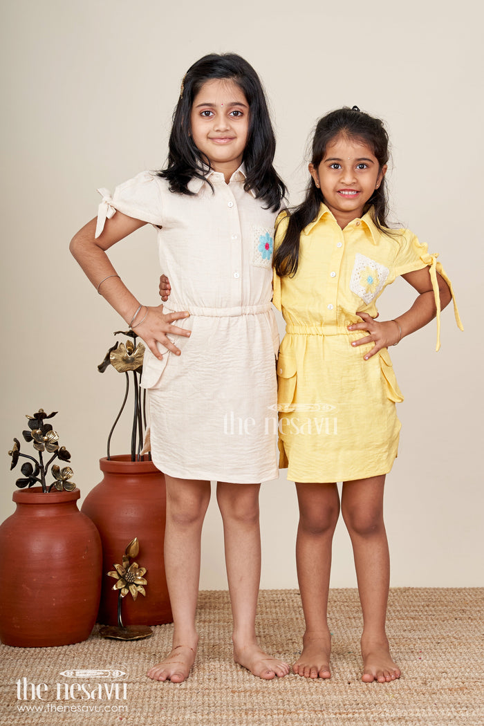 The Nesavu Girls Cotton Frock Beige girls cotton frock with collar and crochet flower patch Nesavu Nesavu beige girls cotton frock with collar and hand-crochet flower patch