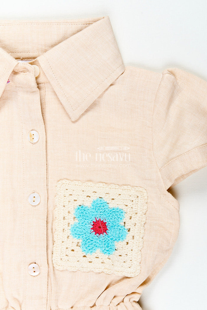 The Nesavu Girls Cotton Frock Beige girls cotton frock with collar and crochet flower patch Nesavu Nesavu beige girls cotton frock with collar and hand-crochet flower patch