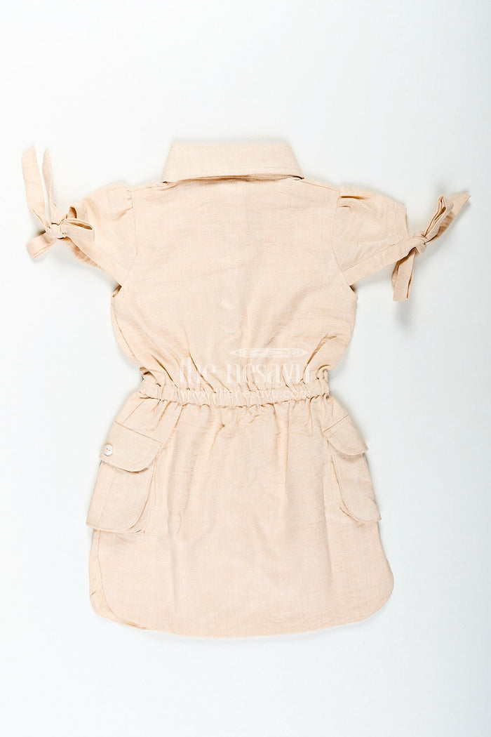 The Nesavu Girls Cotton Frock Beige girls cotton frock with collar and crochet flower patch Nesavu Nesavu beige girls cotton frock with collar and hand-crochet flower patch