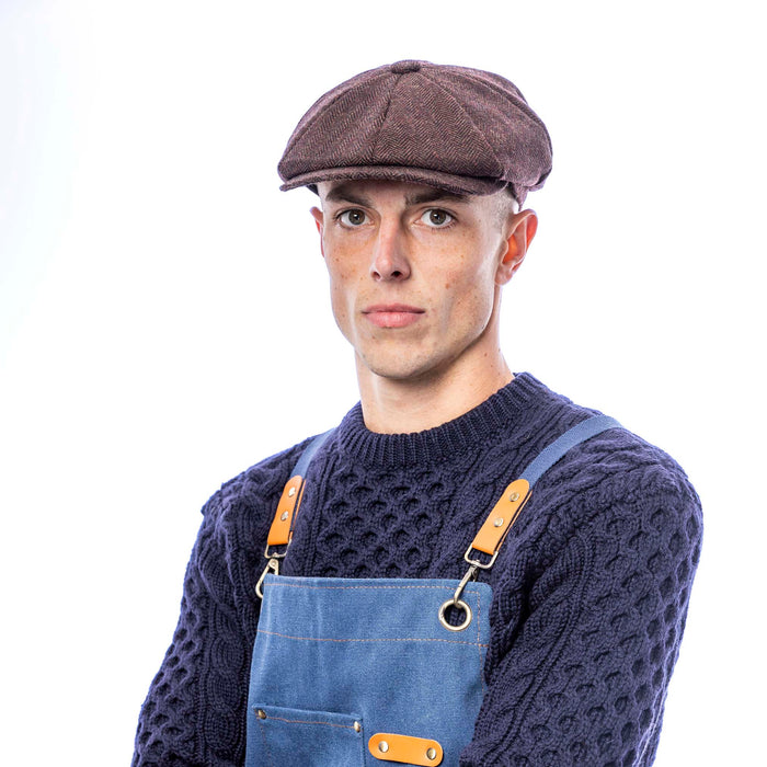 Male model wearing navy blue utility apron