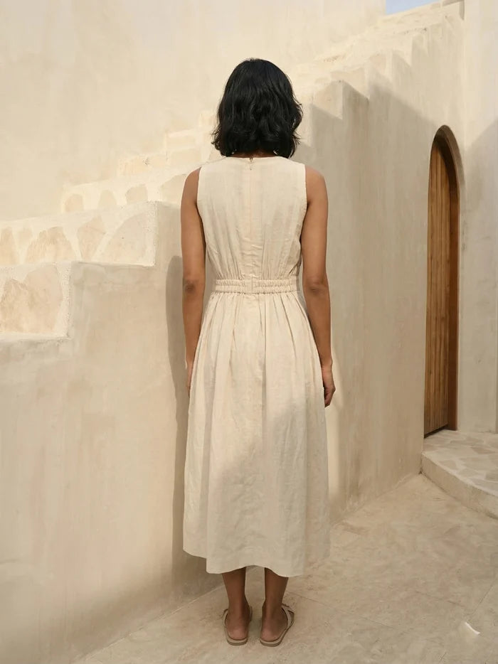 Back view of Celia Linen Midi cream dress – structured linen sleeveless A-line dress for casual and semi-formal day events