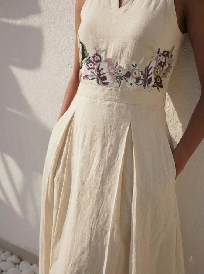 Close-up of hand-embroidered floral cross-stitch detail on Celia Linen Midi cream dress – artisanal embroidery on premium linen