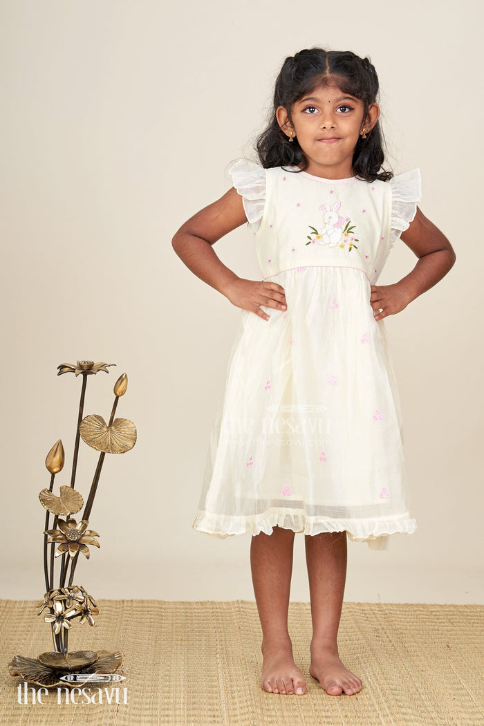 The Nesavu Girls Chanderi Frock Girls Animal Print Ruffle Dress in Chanderi with Thread Embroidery and Pink Floral Accents Nesavu Girls Animal Print Ruffle Dress Chanderi Bunny Motif Floral Embroidery | The Nesavu