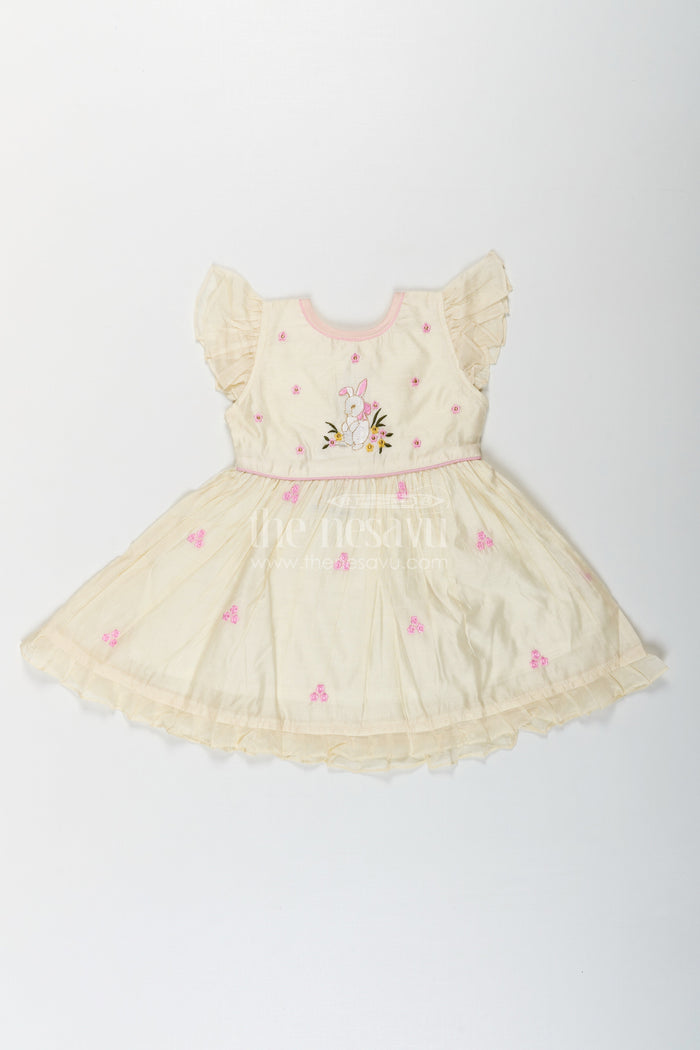 The Nesavu Girls Chanderi Frock Girls Animal Print Ruffle Dress in Chanderi with Thread Embroidery and Pink Floral Accents Nesavu Girls Animal Print Ruffle Dress Chanderi Bunny Motif Floral Embroidery | The Nesavu