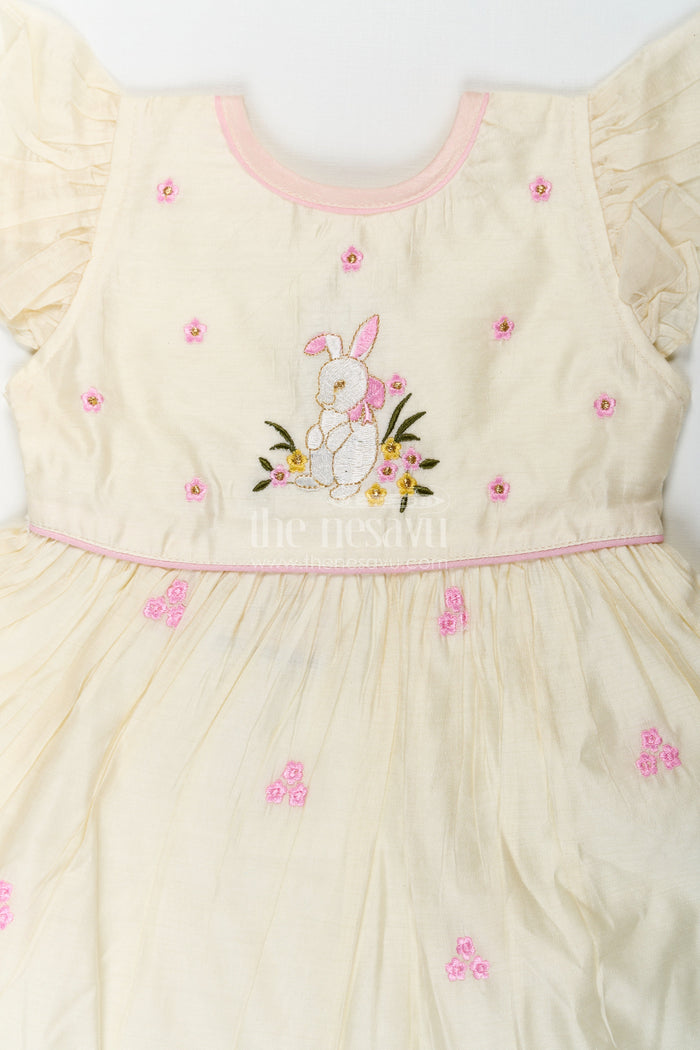 The Nesavu Girls Chanderi Frock Girls Animal Print Ruffle Dress in Chanderi with Thread Embroidery and Pink Floral Accents Nesavu Girls Animal Print Ruffle Dress Chanderi Bunny Motif Floral Embroidery | The Nesavu