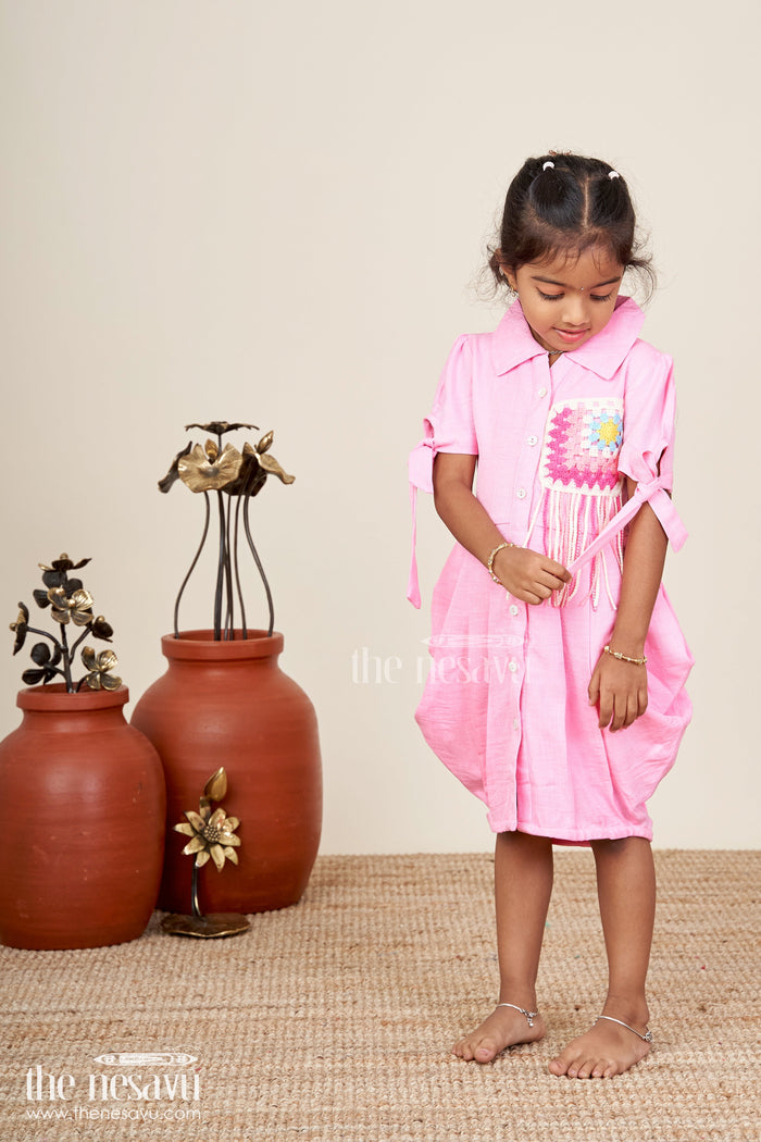 The Nesavu Girls Cotton Frock Girls pink cotton frock with crochet patch and shirt collar Nesavu Nesavu pink girls cotton frock with crochet patch and short tie sleeves for casual wear