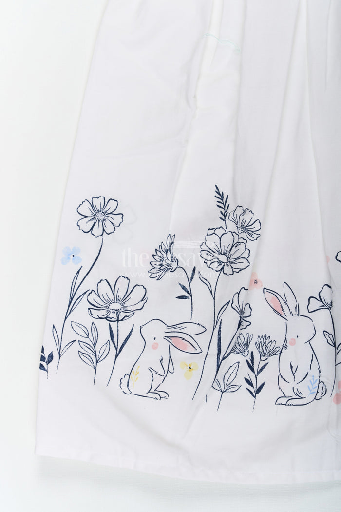The Nesavu Girls Cotton Frock Girls White Frock Dress in Cotton with Digital Bunny Border and Pintuck Front Panel Nesavu Girls White Frock Dress Cotton Digital Bunny Floral Border Pintuck Front | The Nesavu