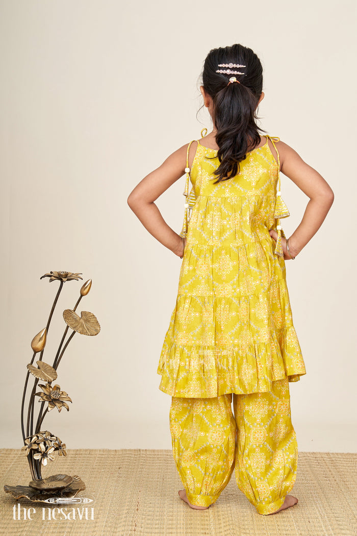The Nesavu Girls Sharara / Plazo Set Girls yellow sharara set with printed tiered kurti for festive dressing Nesavu Nesavu girls yellow cotton sharara set with tiered flared kurti and digital print for festive wear