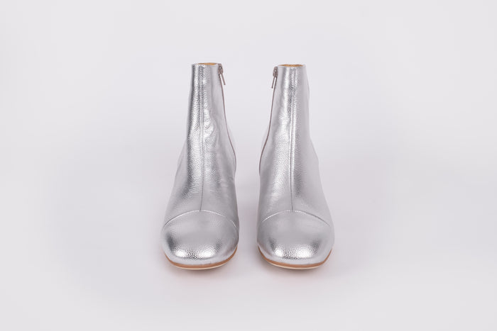 Izzy Boot by Otto + Ivy - a front profile of a silver boot for tall women with large feet, featuring silver leather and a low chunky heel.