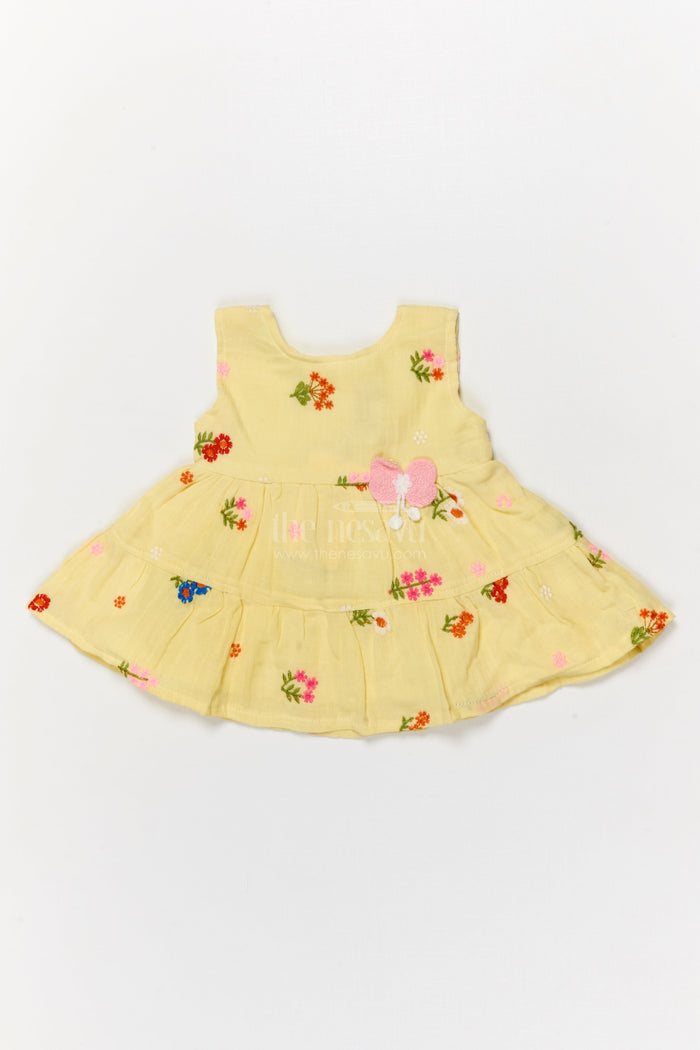 The Nesavu Baby Cotton Frocks Muslin Cotton Frock for Baby Girl's Summer Playdates and Casual Wear Nesavu Nesavu muslin cotton frock with floral embroidery and butterfly patch for baby girl summer wear