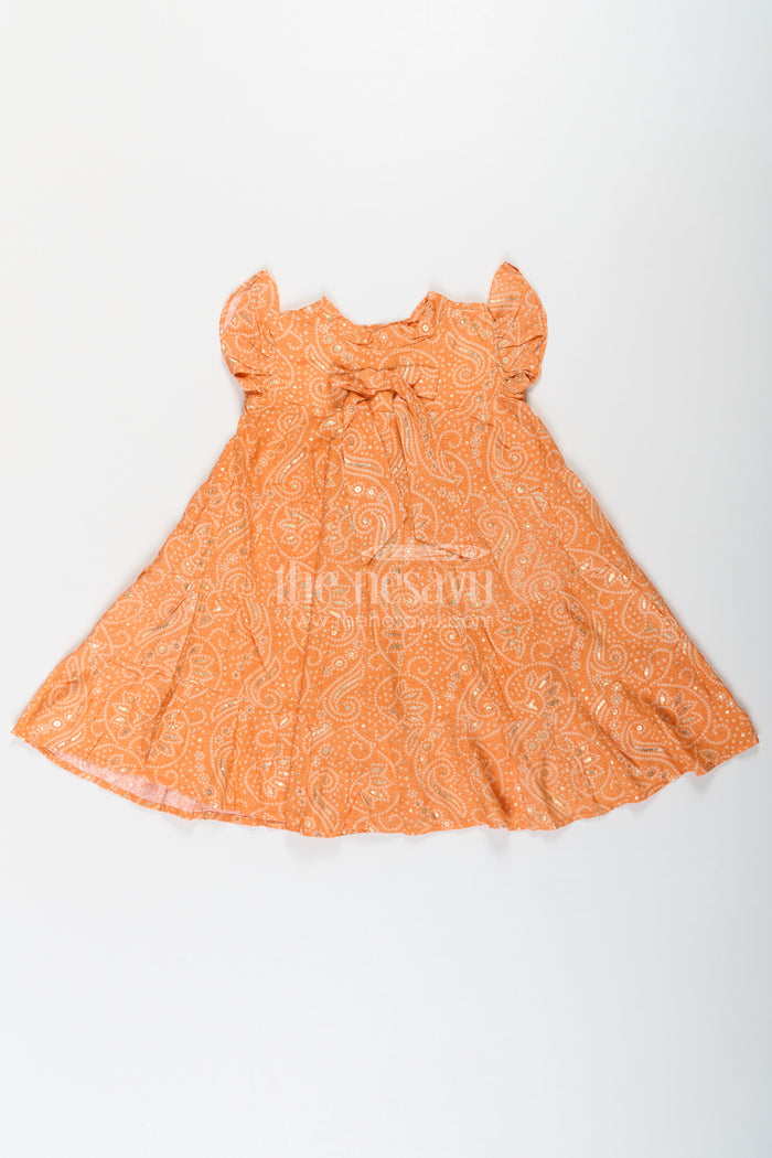 The Nesavu Girls Cotton Frock Nesavu Casual Cotton Frocks for Girls in Rayon with Orange Bandhani Print and Gold Foil Details Nesavu Nesavu Casual Cotton Frocks Girls Rayon Orange Bandhani Print Gold Foil Details