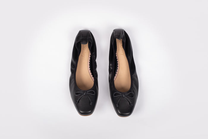 Aerial shot of Olivia Flats in black. A womens large sizes elasticated pump in Uk sizes 8-12