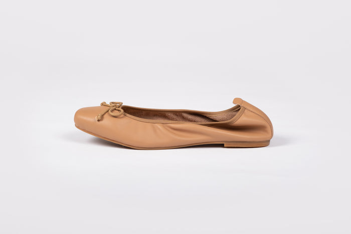 Side shot of Olivia Flat in Tan, and elasticated black flat shoe in womens larger UK sizes 8-12
