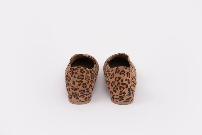 Back shot of womens size 9 large sized Pair of leopard print slippers on a white background