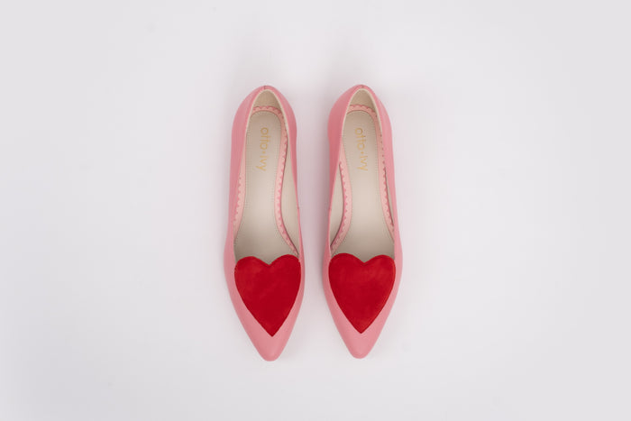 Aerial shot of womens large sized pink and red love heart flat shoes in large sizes 42 43 44 45 46