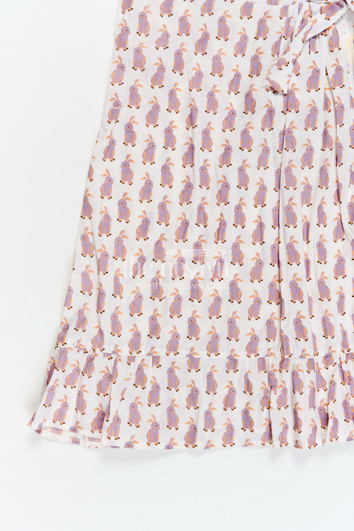 The Nesavu Girls Cotton Frock Soft Cotton Frock for Girls with Hand Block Bunny Print and Elegant Frill Edges in Off White Nesavu Nesavu Girls Soft Cotton Frock Hand Block Bunny Print Frilled Hem Creamy White