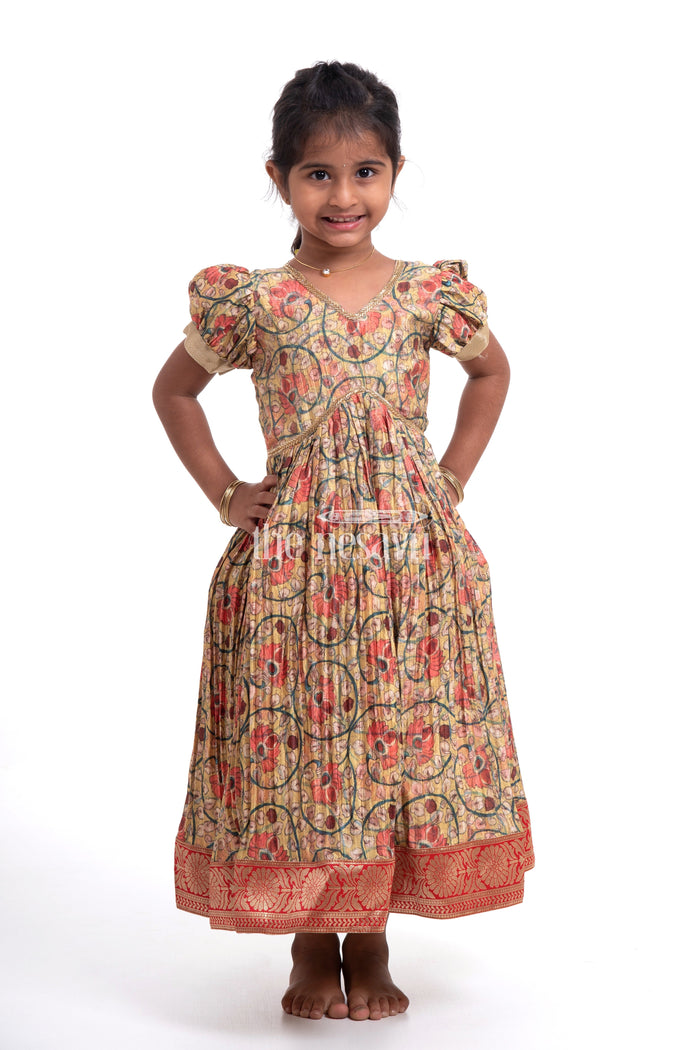 The Nesavu Girls Silk Gown Traditional Yellow Kalamkari Chinon Party Gown for Girls Nesavu Traditional Yellow Kalamkari Chinon Party Gown for Girls - Festive Attire