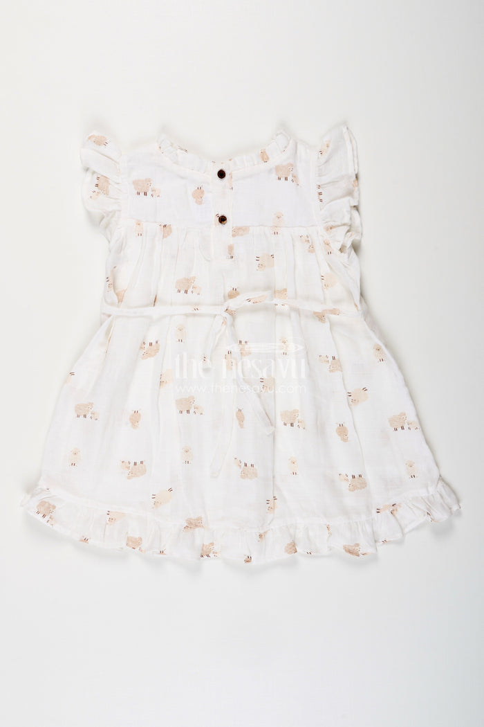 The Nesavu Girls Cotton Frock White Muslin Cotton Frock for Baby Girls with Soft Sheep Print Nesavu Nesavu baby girls white muslin cotton frock with sheep print and ruffle detailing for everyday wear