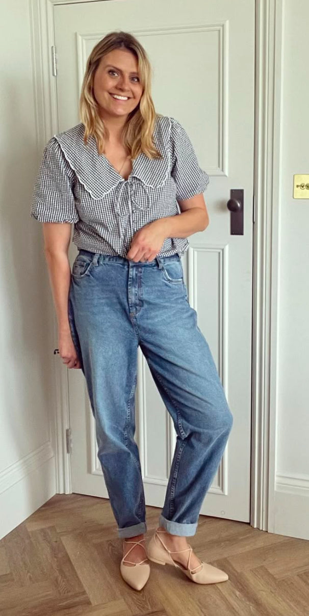 Model wearing Winnie flats, a tie up pump in larger womens sizes 8-12