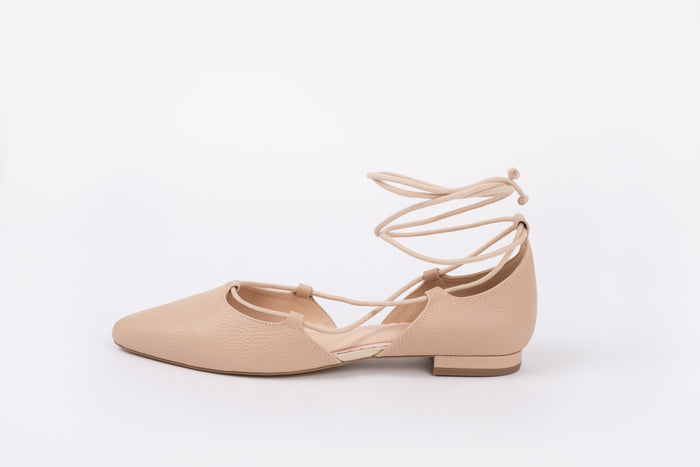 Side view of Winnie Flat in beige, Tie up flat shoes available in women's sizes 42-46